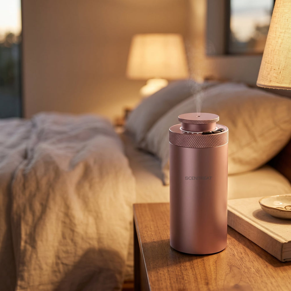 Pink mini diffuser on a nightstand