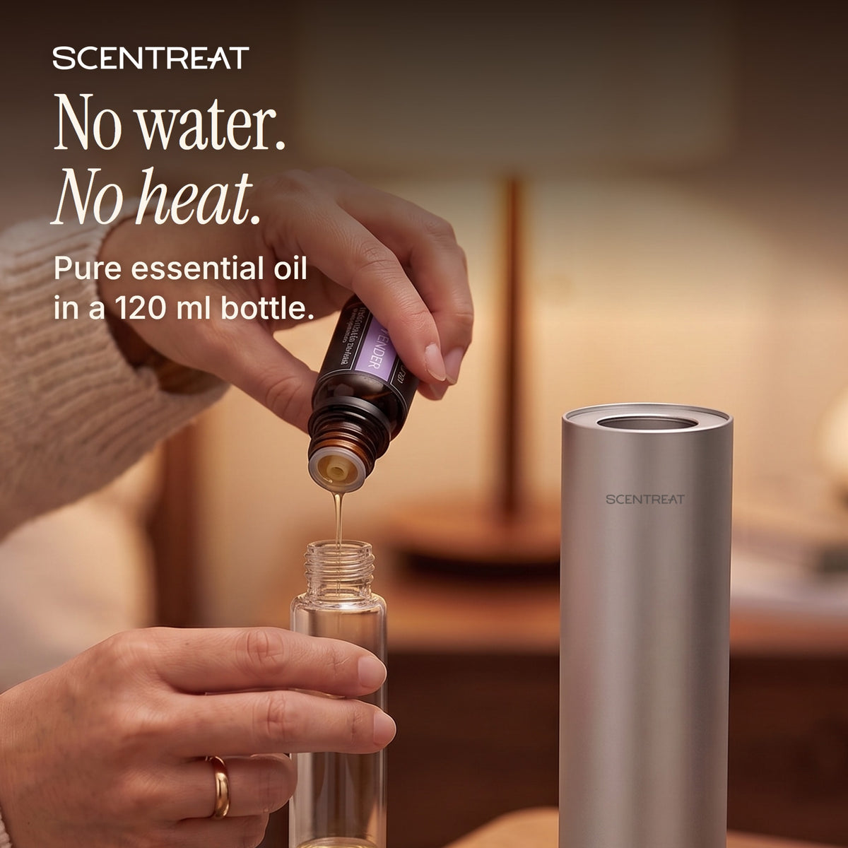 Pouring SCENTREAT Lavender essential oil into the 120 ml glass bottle of the Spire cordless waterless diffuser