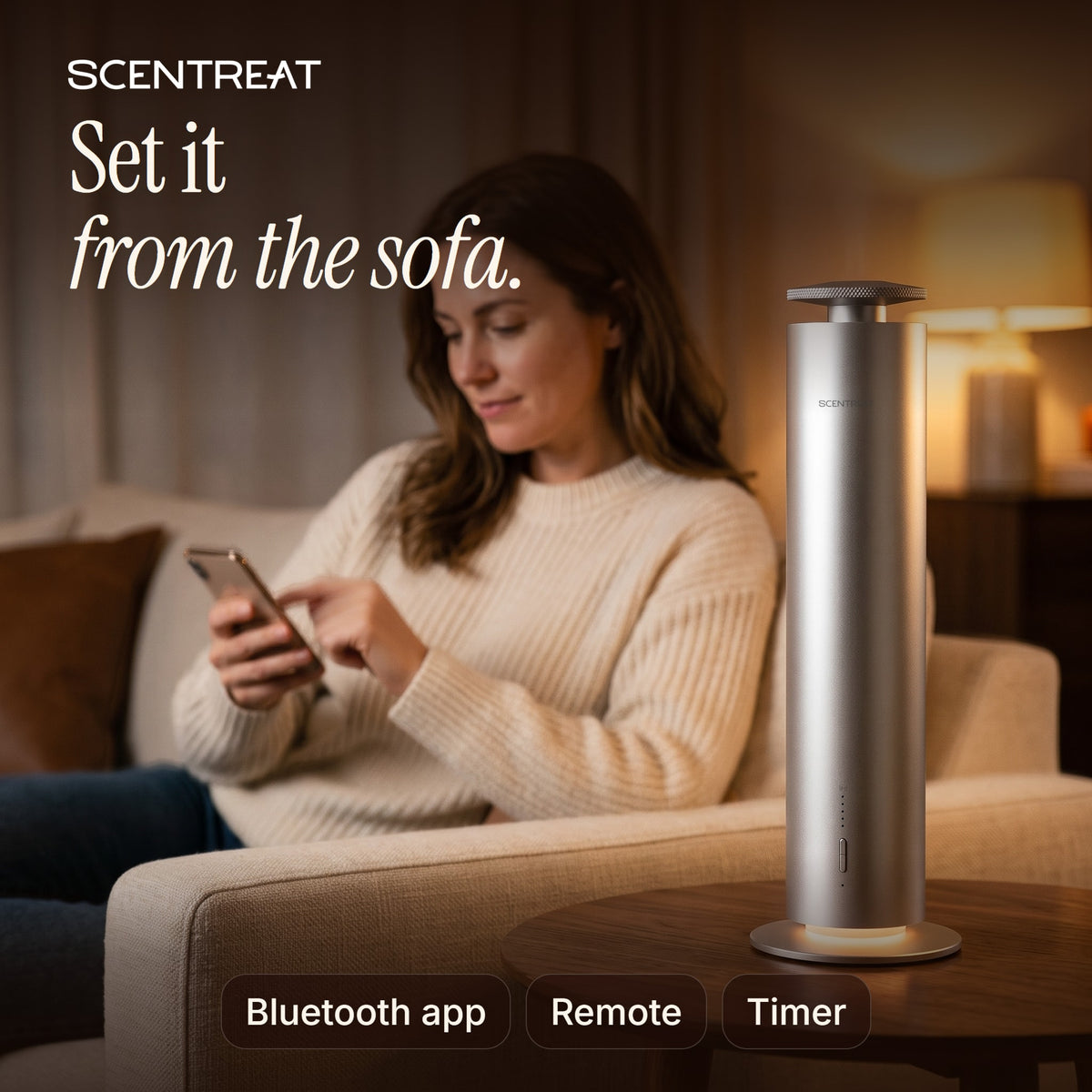 Woman setting the tower diffuser from her phone on the sofa