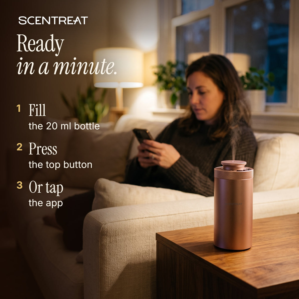 Woman using the app with the mini diffuser beside her