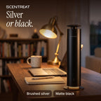 Matte black tower diffuser on a home office desk