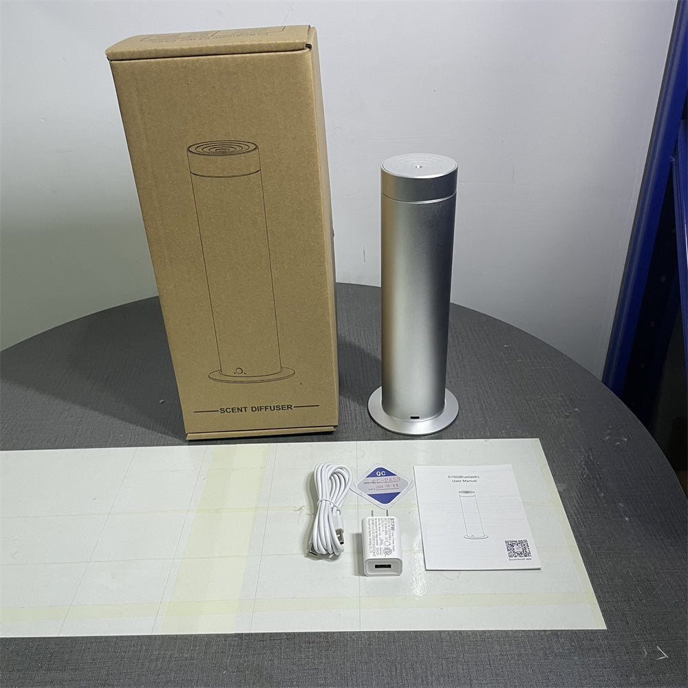 Pillar silver cold-air diffuser unboxed with USB-C cable, adapter and manual