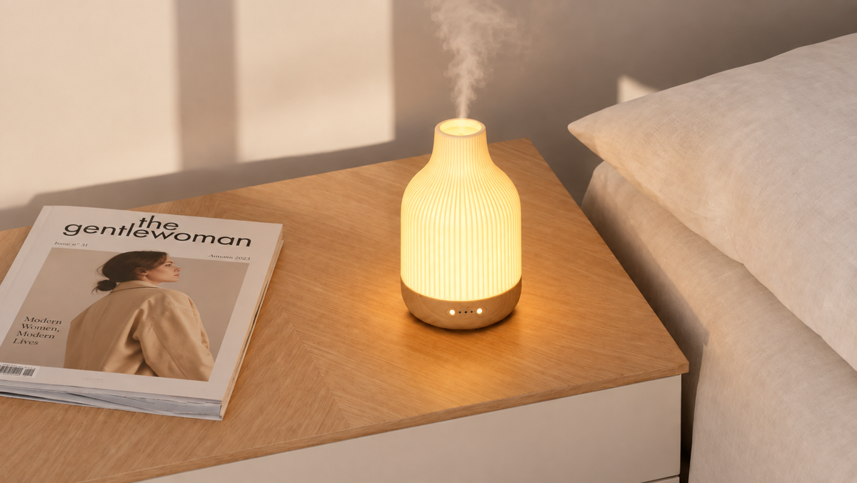 Ceramic diffuser glowing on a bedside table