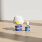 Pet calming diffuser with its 48 ml vial and a spare refill vial on a table