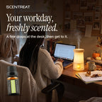 Lemongrass essential oil in a diffuser in a cozy room