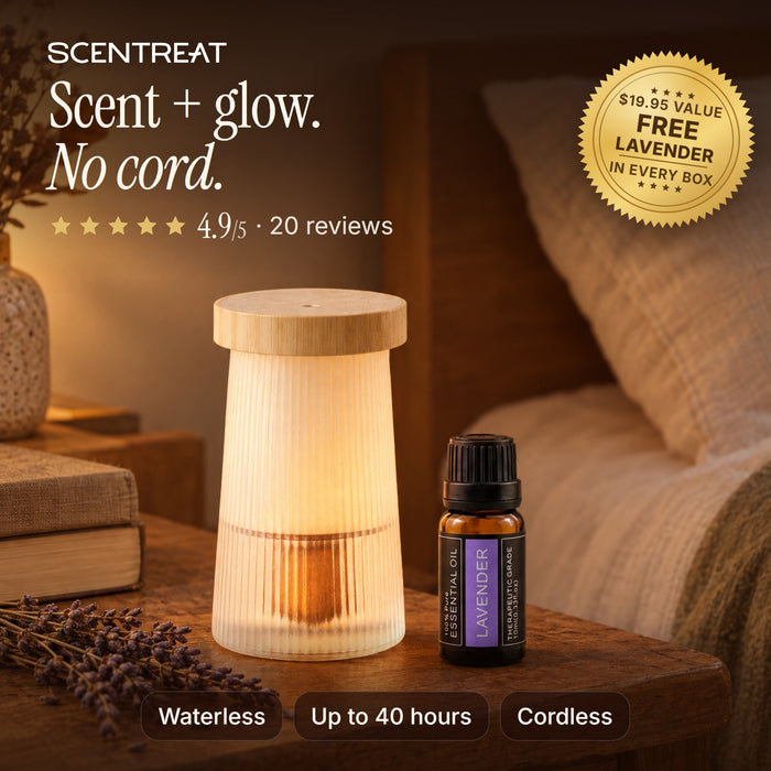 Night light diffuser glowing on a bedside table, cordless and waterless