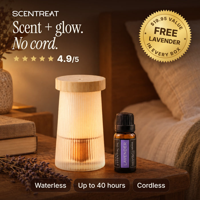 Night light diffuser glowing on a bedside table, cordless and waterless