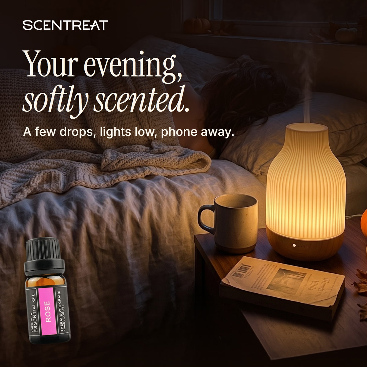 Rose essential oil in a diffuser in a cozy room
