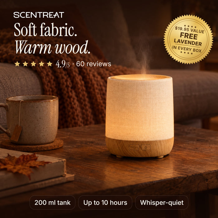 Wood essential oil diffuser with fabric cover glowing in a cozy living room