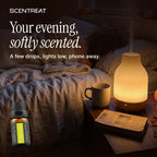 Ylang Ylang essential oil in a diffuser in a cozy room